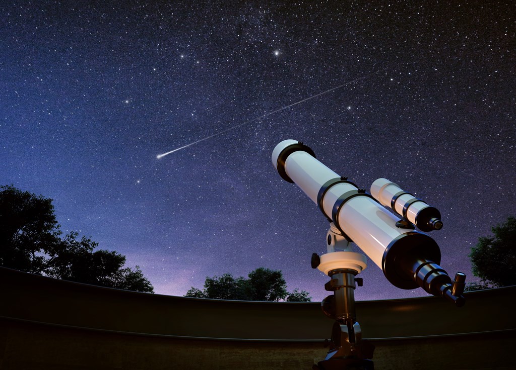 Telescope pointed upward at at star filled sky