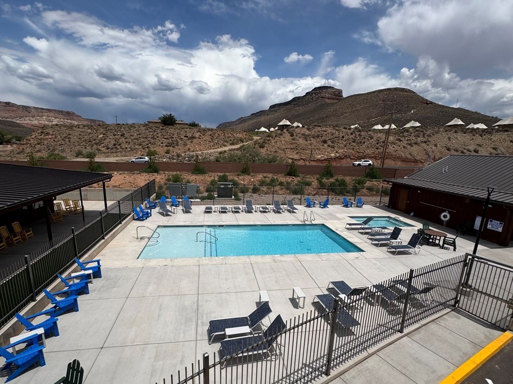 A high view of the pool with mountains in the background at Zion National Park KOA Holiday
